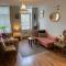 Quirky town centre apartment with river terrace