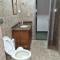 Casa com dois quartos,dois banheiros,sendo uma suíte,sala de estar cozinha e garagem - بوكوس دي كالداس