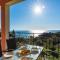 Studio Apartments with large swimming pool and Sea view at Pelekas Beach, Corfu