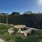 Casa para 6 a 100m de la playa jardín compartido