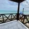 A private chale less than 20 feet from the ocean
