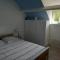 Chambre bleue avec accès plage