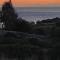House by the beach,next to village,sunset view