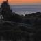 House by the beach,next to village,sunset view