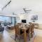 Waterfront Wonder Expansive Indoor-Outdoor Haven