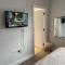En-suite bedroom in a family home near Gatwick airport and Horley station