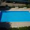 Red flat with shared pool and private parking