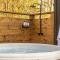 Glamping cottage with glass front and hot tub!