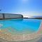 Luxurious waterfront villa Christina in the area of Melissaki with a swimming pool, sea and sunset view