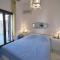Luxurious waterfront villa Christina in the area of Melissaki with a swimming pool, sea and sunset view