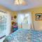 Pleasant ocean view home with balcony, rocking chairs, soaking tub, AC, & W/D