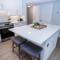NEW Rental - 3BR 3BA Corner Beachfront - 2024 Remodel - 3 pools, tiki hut, gym, tennis
