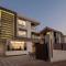 Grande Montana by StayVista - Luxurious Hillside Villa featuring Pool, Theater, and Games Room