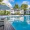 Fig Oasis—Poolside Resort Living at The Beach Club