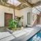SaffronStays Moringa WishingTree - 3-BR villa near Nathdwara with pool, lawn and hillside views