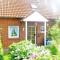 Ferienhaus Huus Wattenmeer in Nessmersiel mit Garten, Terrasse, Sauna, Räder, und Grill