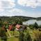 Wooden chalet with terrace near a swimming lake