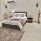 Elegant Garden Stay with 2 Living Areas, 2 Bedrooms, 1 Full and 1 Half Bath for 6 Guests