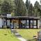 Wooden chalet with terrace near a swimming lake