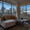 Luxury Corner Unit DT w Tower Views! Near Stampede, BMO Centre! FREE Banff Pass, Parking, Wine!