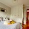 Peaceful guest suite with balcony views and garden setting