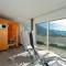 H19 - Modernes Ferienhaus 145qm, 3SZ, Wellnessbereich mit Sauna und Dachterrasse mit Panoramablick, Kühlen und Heizen mit Geothermie