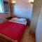 Maison en bois 4 personnes sur lac, Cantal - Lacapelle-Viescamp