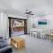 Modern Split-Level 2-Bedroom Condo with Pools, Terrace & Easy Beach Access