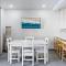 Modern Split-Level 2-Bedroom Condo with Pools, Terrace & Easy Beach Access
