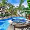 Modern Split-Level 2-Bedroom Condo with Pools, Terrace & Easy Beach Access