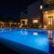 Four Seasons private villa - seaview - big heated pool - gym - sport activities - Гуве