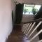 En-suite with double bed on mezzanine and desk in family home - Hertford