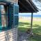 Wooden beach house / Nea Roda, Halkidiki