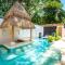Bohemian Tropical Villa with a Tiki-Style Swimming Pool & Swim-Up Bar with an Attached Studio Apartment Bohemian Tropical Villa with a Tiki-Style Swimming Pool & Swim-Up Bar with an Attached Studio Apartment