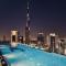 64th floor rooftop pool offering amazing Burj Khalifa views, 2BR apartment in Paramount Hotel Midtown - دبي