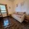 Villa La Lecceta surrounded by greenery and sea view with sunset