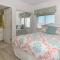 Ocean Condo 104 ~ Ground Floor Corner Condo with wrap around balcony Walk right out to Pool - New Smyrna Beach