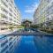 212B Amani Grand Resort Residences near to Airport with pool, gym, wifi, netflix - Pusok