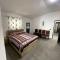 Cozy 5-Bed Home with Balcony