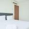Homey and Comfortable 2BR Tifolia Apartment By Travelio