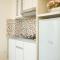 Homey and Comfortable 2BR Tifolia Apartment By Travelio