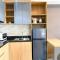 Homey and Spacious Studio Vasanta Innopark Apartment By Travelio
