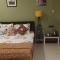 Riverside Palm Deluxe Double Room with AC in a house near Kamakhya and IHR