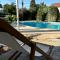 Mediterranean poolside garden cottage