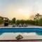 StayVista at The Cityscape with Lawn & Pool