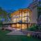 SaffronStays Sonnet - 4BR veg pool villa with grand piano, theater, lawn & mountain views near Mumbai