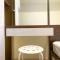 Spacious and Homey 2BR with Extra Room at Meikarta Apartment By Travelio