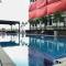 Modern Look and Tidy Studio Gateway Park LRT City Jatibening Apartment By Travelio