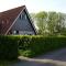Gemütliches Ferienhaus mit Garten und einer Terrasse mit Windfang