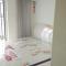 Foto: Qingdao Hongcheng Apartment 4/6